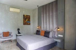 Primary bedroom suite with private living space Sri Lanka luxury villa